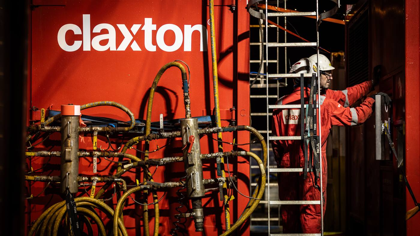 Claxton Engineering cutting spread on deck, hydraulic hoses and tooling racked against a container
